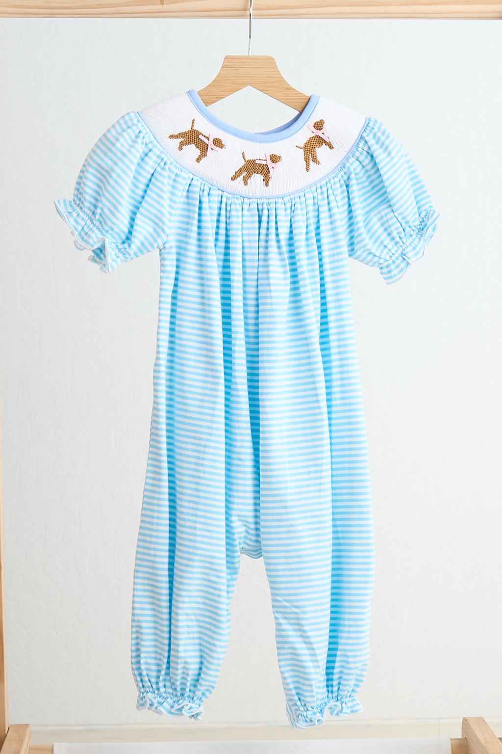 Blue puppy hand smocked girl romper