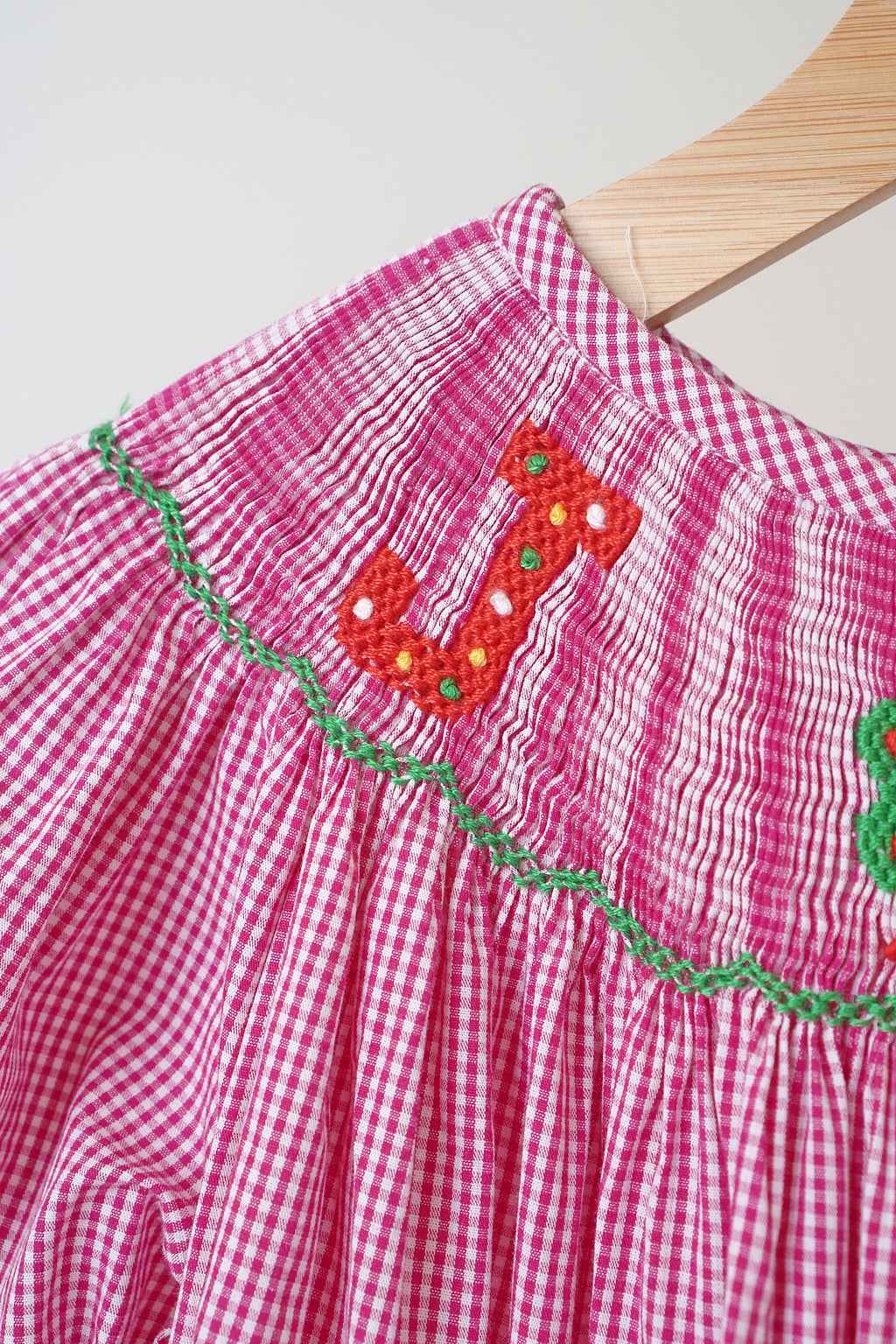 Pink christmas joy hand smocked gingham dress