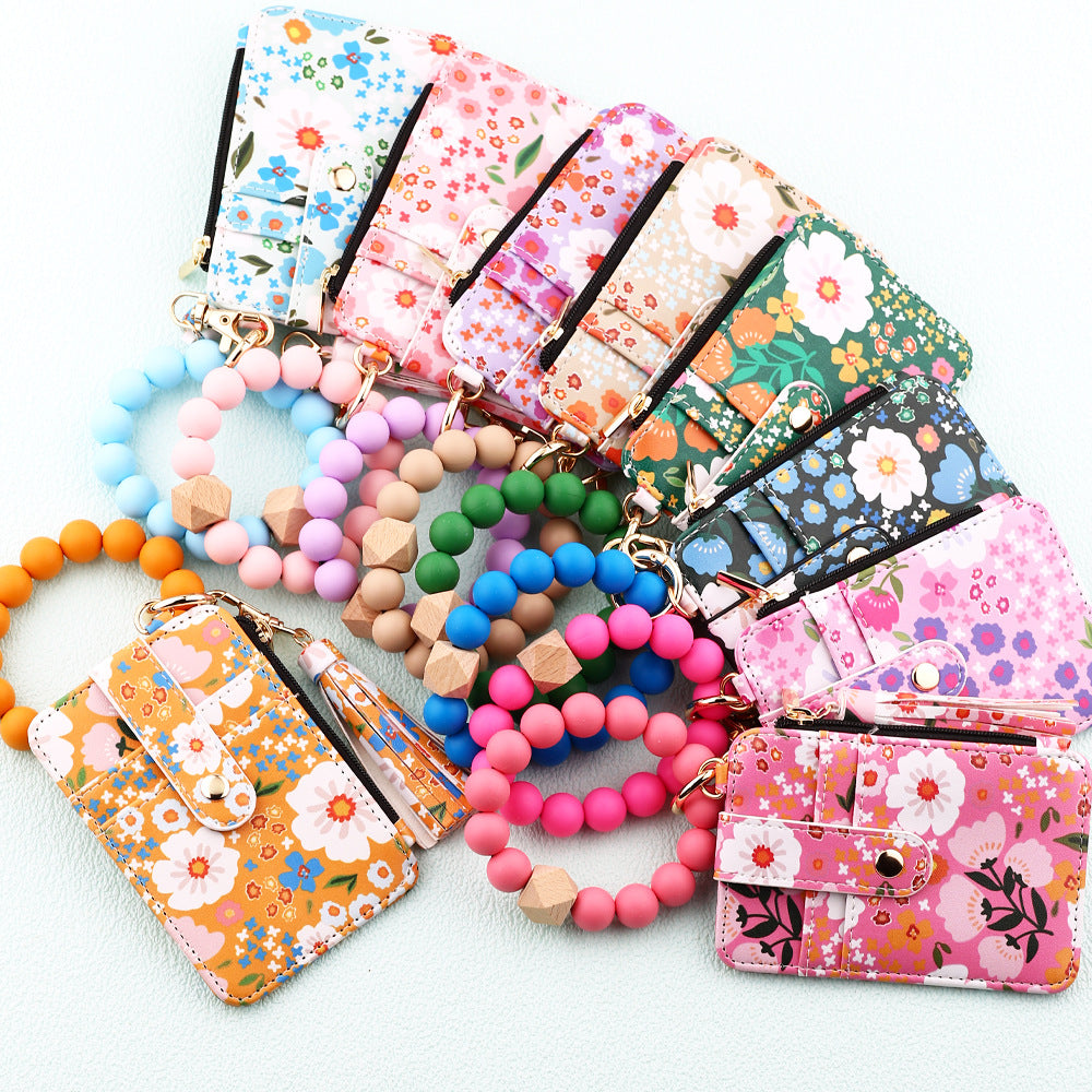 ID bag, silicone bracelet, floral folded edge card bag, TK printed leather wallet, keychain.