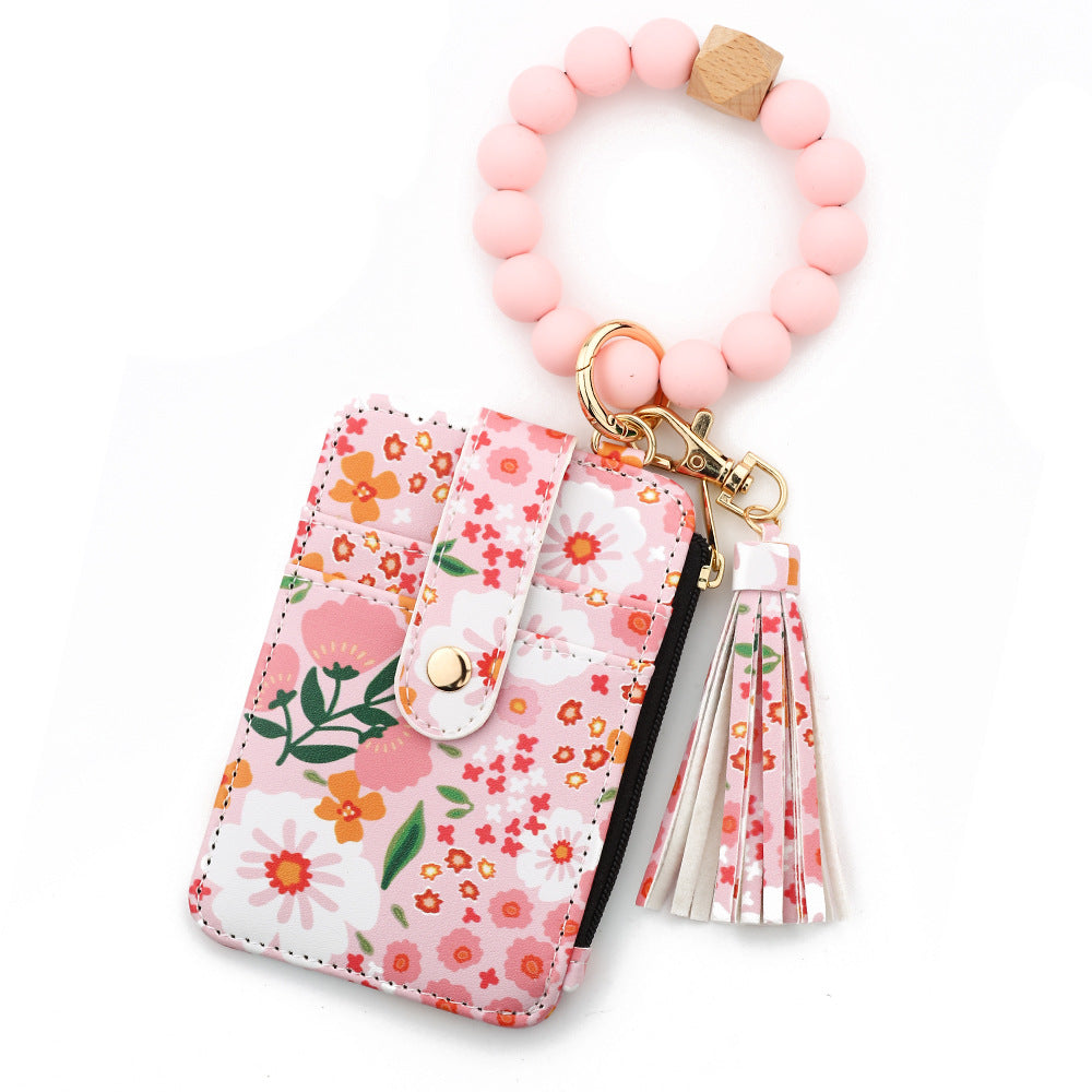 ID bag, silicone bracelet, floral folded edge card bag, TK printed leather wallet, keychain.