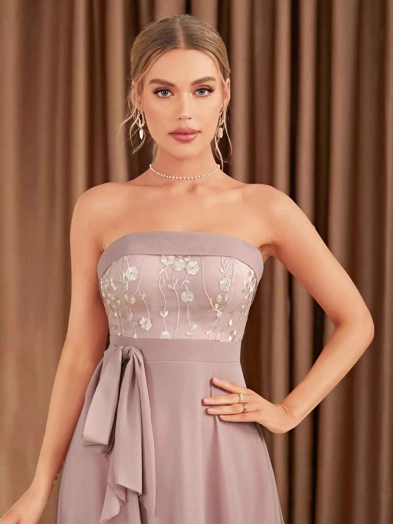 The adult formal dress is wrapped around the chest and decorated with a belt on the back